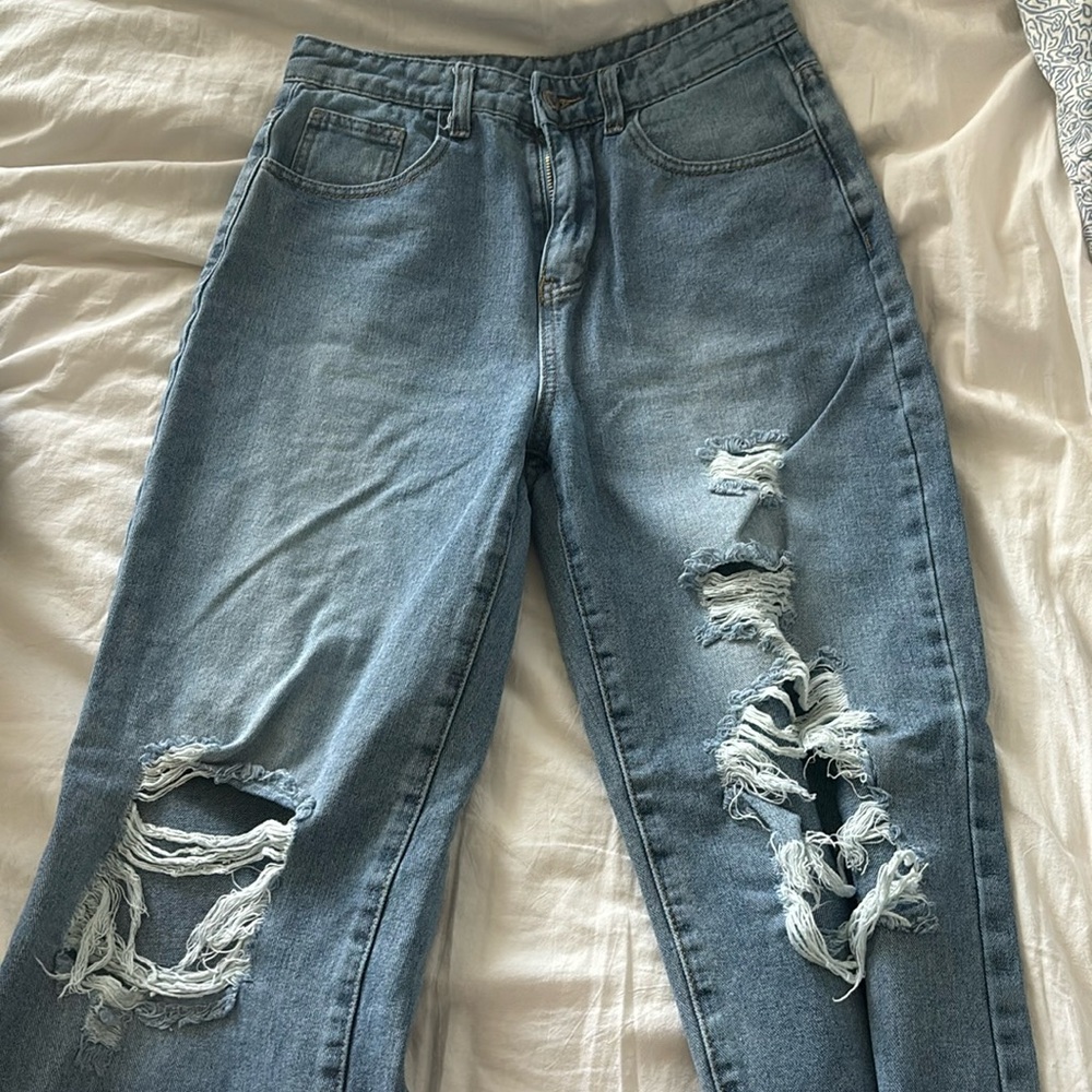 High waisted light washed ripped jeans